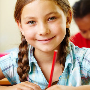 Primary school pupil smiling