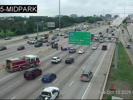TxDOT traffic camera view of southbound US-75 at Midpark Road showing an overturned vehicle and emergency response Tuesday morning
