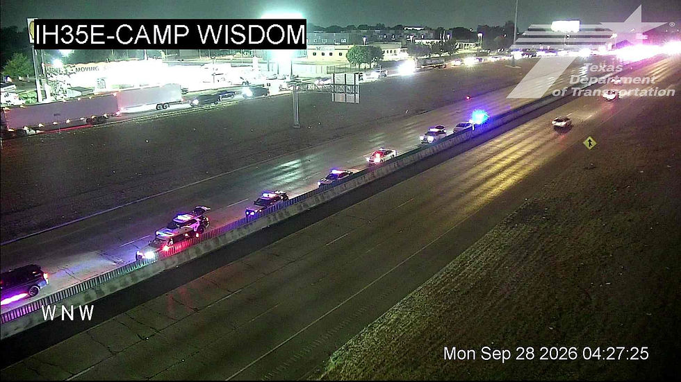 TxDOT traffic camera at IH-35E and Camp Wisdom showing multiple police units and a stopped vehicle after a Monday morning crash