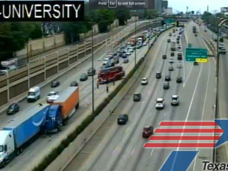 Two 18-wheelers "got into it" on US-75 near University in Dallas, TX