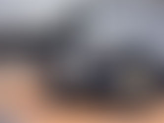 Illustrative stock photo of a damaged motorcycle lying on a roadway next to a car; not a photo of the FM 920 crash