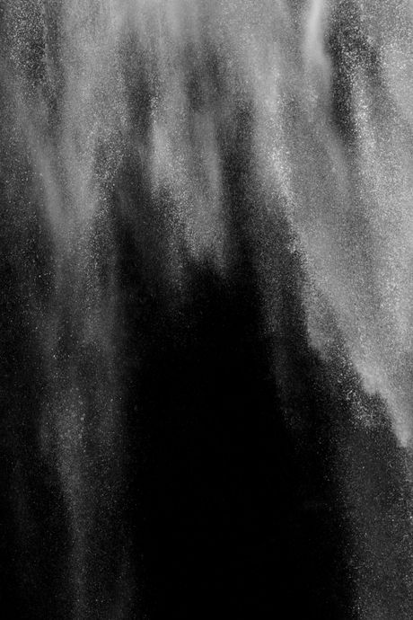 An abstract black and white photo of falling water.