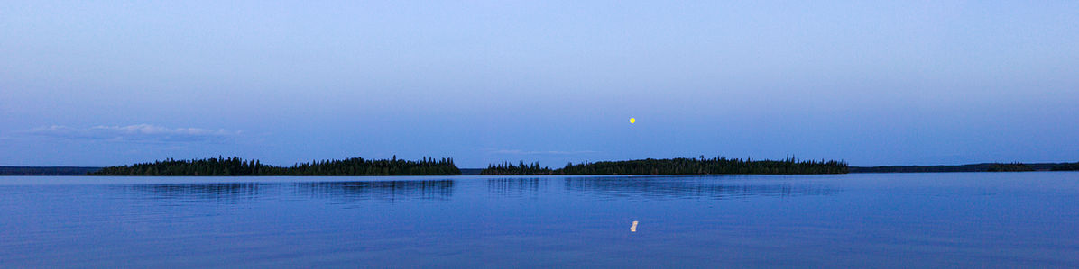 A calm lake at dusk.
