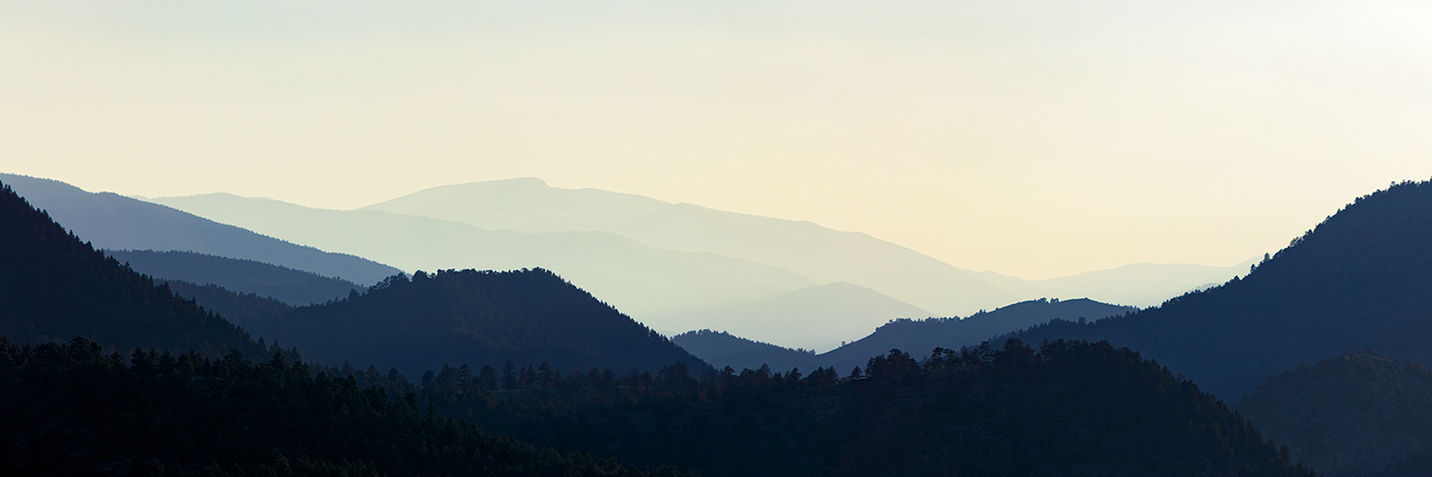 Silhouetted mountains during sunset.