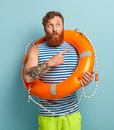 shot-puzzled-surprised-redhaired-male-rescuer-with-lifebuoy_edited.jpg