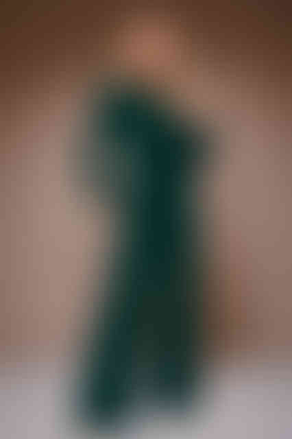 woman dark green jumpsuit wide leg with long sleeves