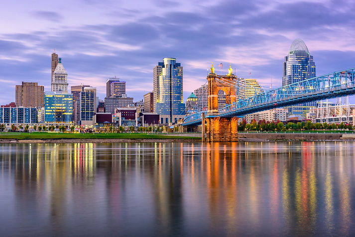 Cincinnati, Ohio, USA downtown skyline and bridge on the river at dusk..jpg