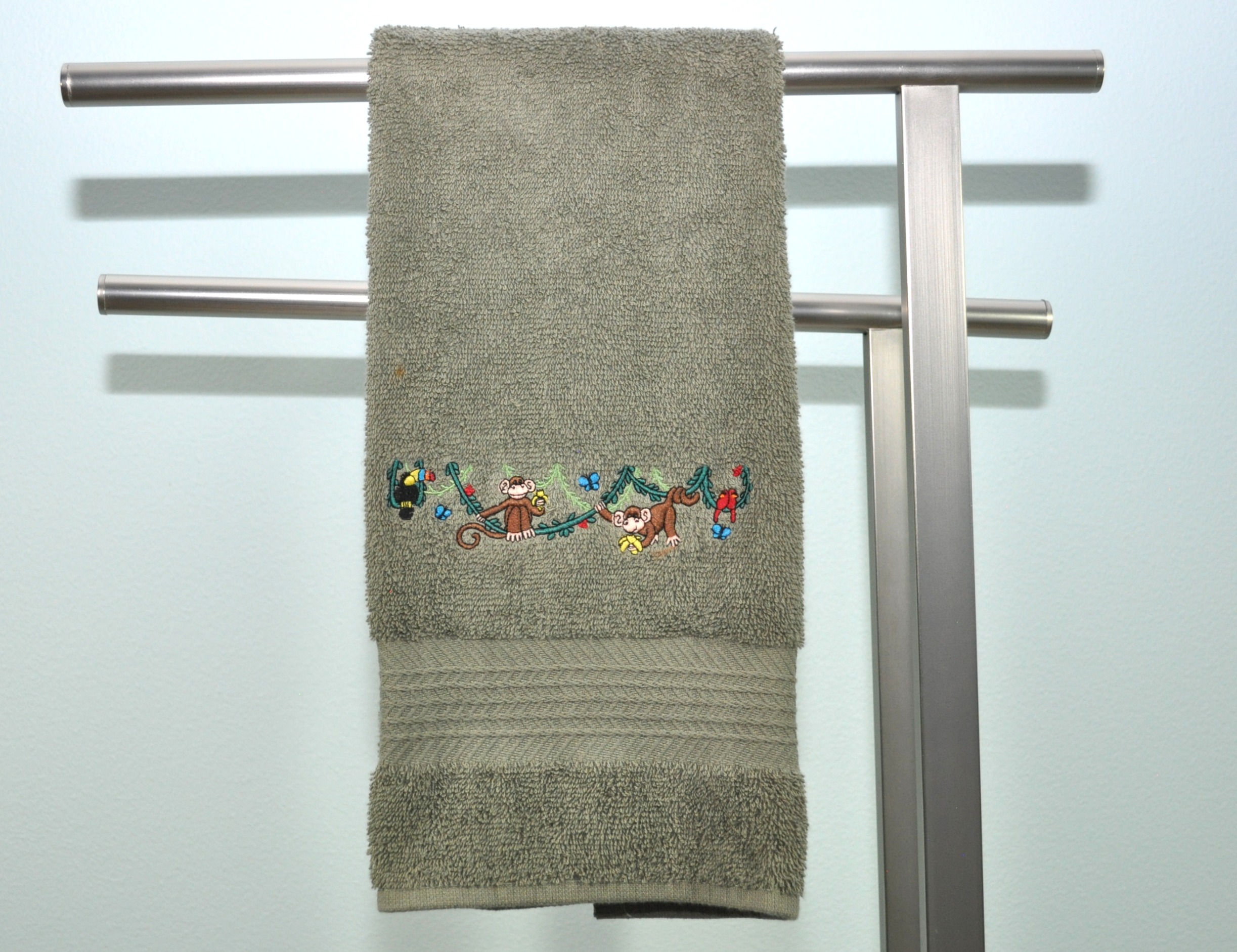 Monkeys swinging on vines Hand Towel