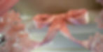 Pink Cherry Blossoms surrounding a puffy, pink bow.