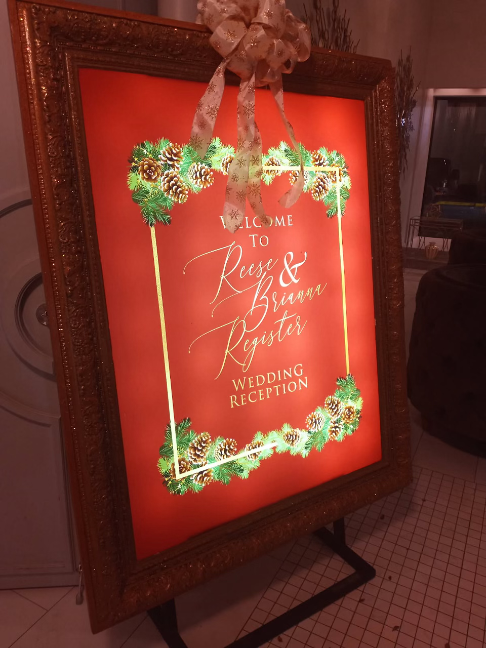 A red, green and yellow decorated sign made for a wedding.