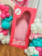 Life-size custom Barbie doll box photo op with pink, teal, and white organic balloon garland by Stellar Events for an extravagant South Georgia party.