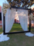 Custom-built floral photo booth frame with neon signage by Stellar Events, perfect for South Georgia garden weddings.