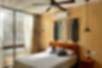 The knotted wall hanging is typical of Mérida and hangs above each bed in different colors.