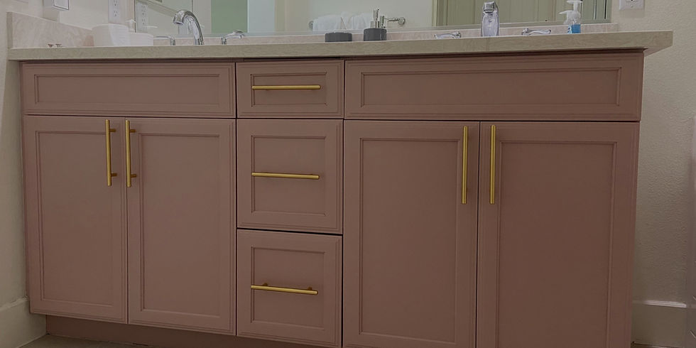 Pink cabinets with golden hardware