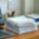image of a stack of papers and on a desk.jpg