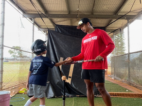 Coach Matt teaching an athlete how to hit during a private lesson