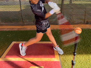 Home Plate Hawaii athlete practicing her swing on a tee.