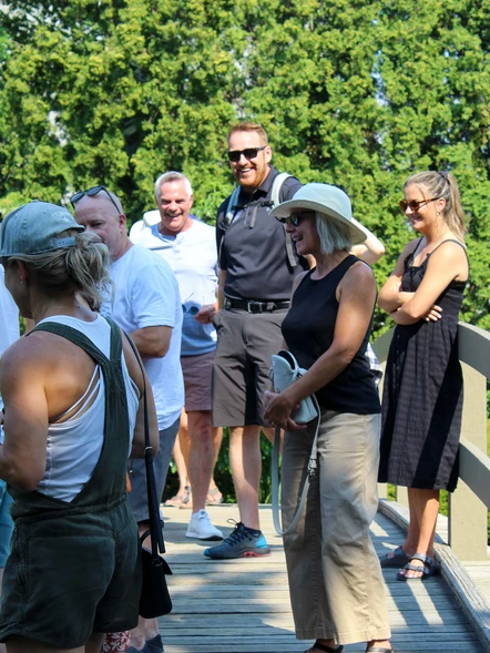 Guests sharing a laugh in a garden