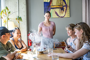 Server showing guests a smoke show