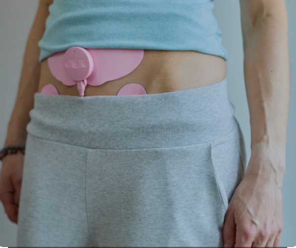 Eye-level view of folded reusable cloth pads on a wooden table