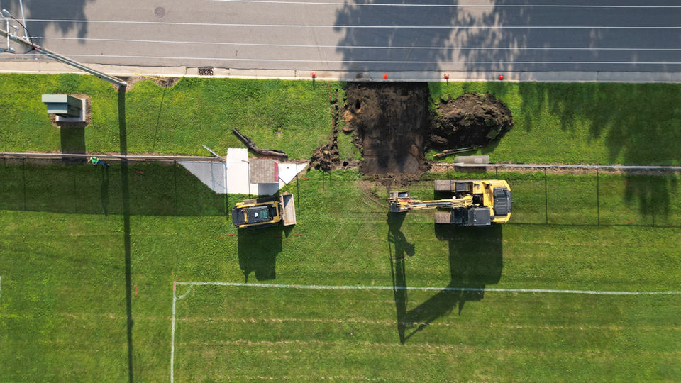 Breaking ground at a local soccer field path addition
