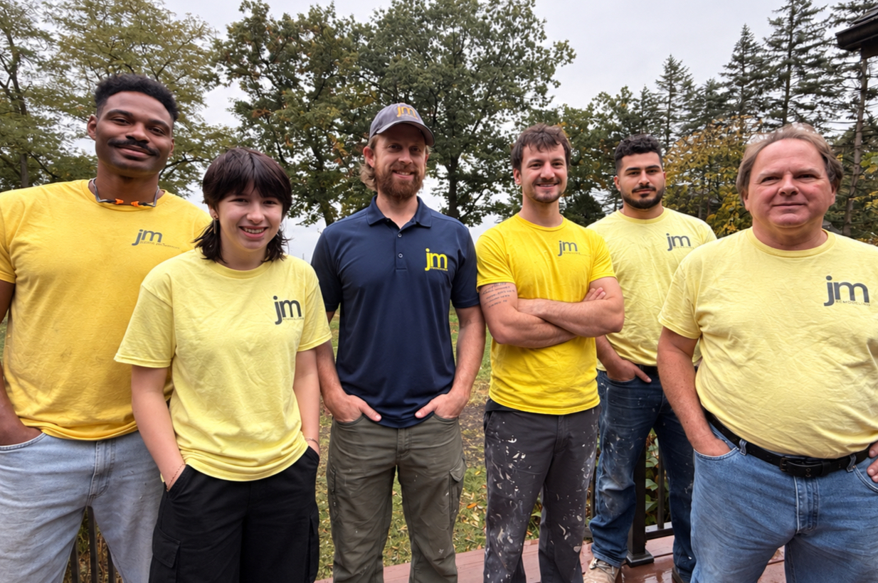 The JM Remodeling team together outdoors