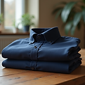 Minimal-product-shot-of-folded-navy-shirt-on-wooden-table.png