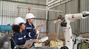 multiracial-industrial-engineers-working-automated-ai-robotic-production-factory-new-indus