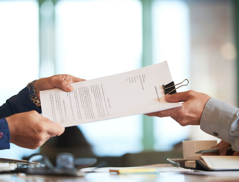 notary passing a contract to his client