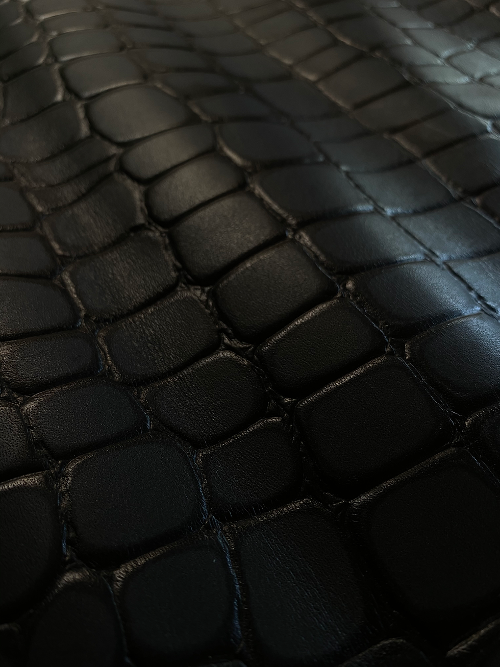 Black leather finished by Tirrena, a tanning company based in Lonigo in the province of Vicenza, Ita