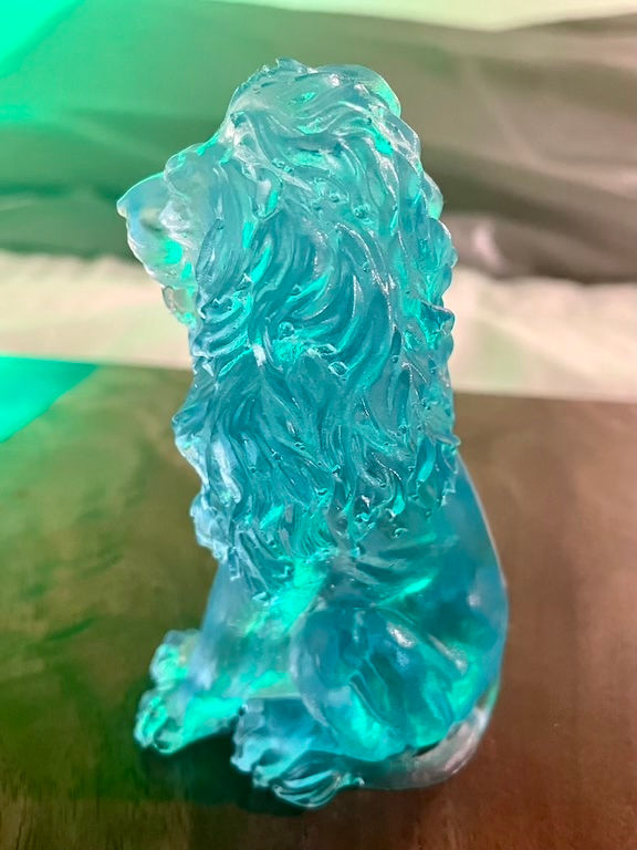 Thumbnail: teal lion figurine