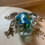 Thumbnail: Clear glass resin frog with blue flowers