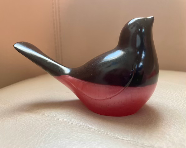 Thumbnail: black red bird