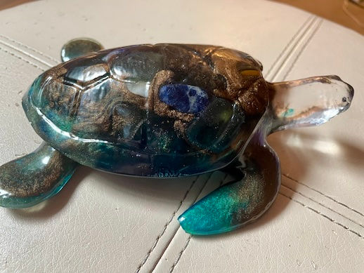 Thumbnail: dark sea turtle figurine
