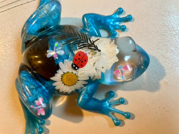 blue glass frog with flowers
