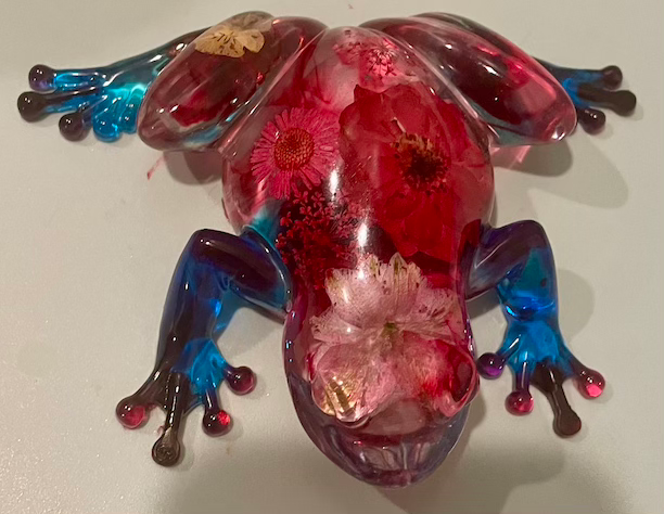 Thumbnail: red flowers glass frog