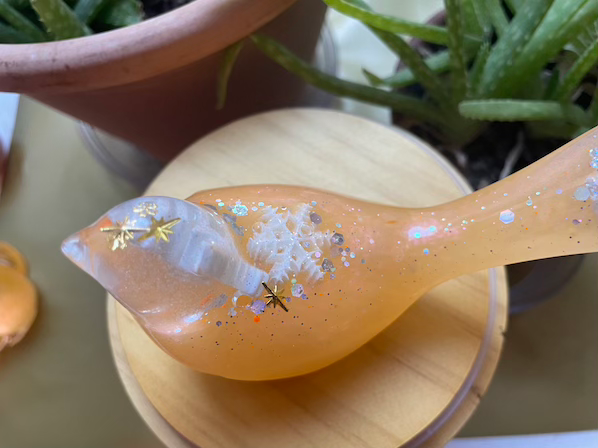 Thumbnail: Grapefruit colored glass resin bird decoration with snowflakes