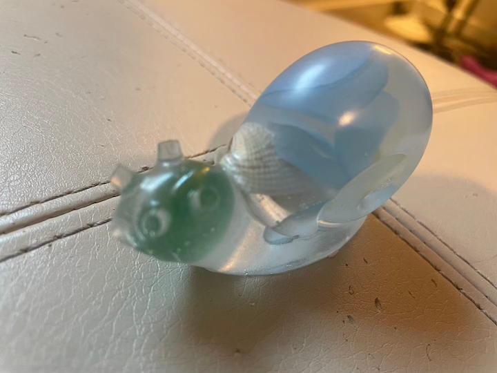 Thumbnail: Snail with light blue flowers