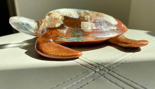 Thumbnail: Brown and clear resin turtle with ocean shells