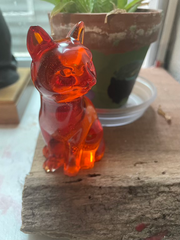 red resin cat