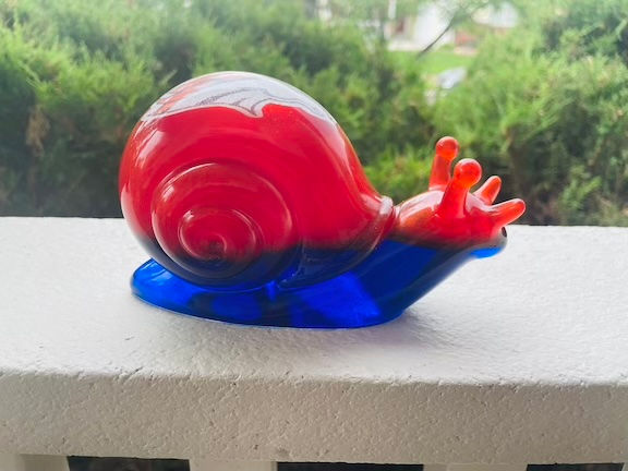 Thumbnail: resin snail on fence