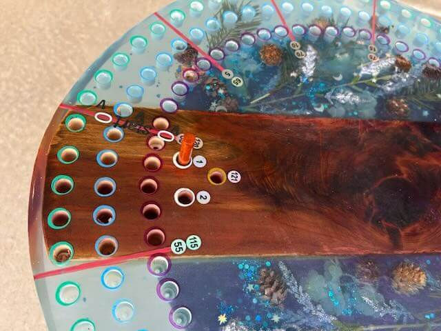 Thumbnail: 20" Resin & Wood Cribbage Board with Pine Cones, Stars