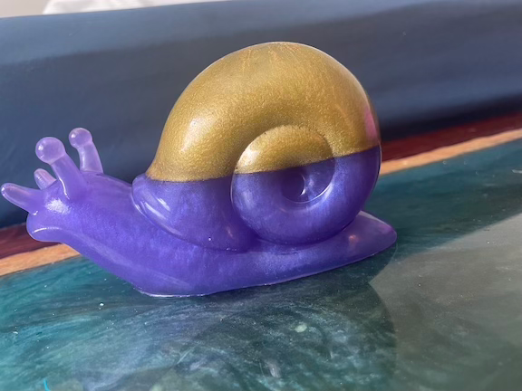 Thumbnail: snail figurine