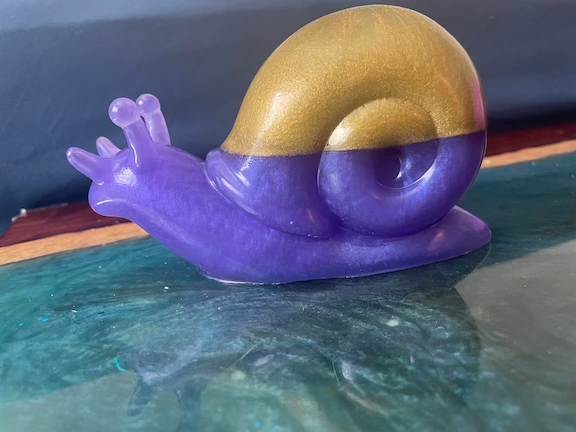 Thumbnail: snail figurine purple and gold
