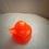 Thumbnail: orange duck figurine
