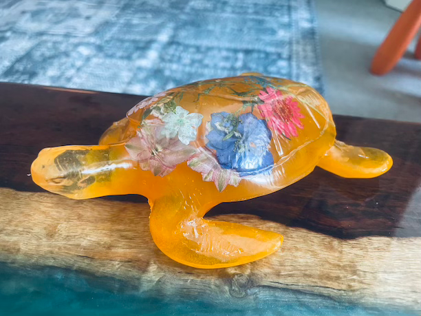 Thumbnail: sea turtle figurine orange