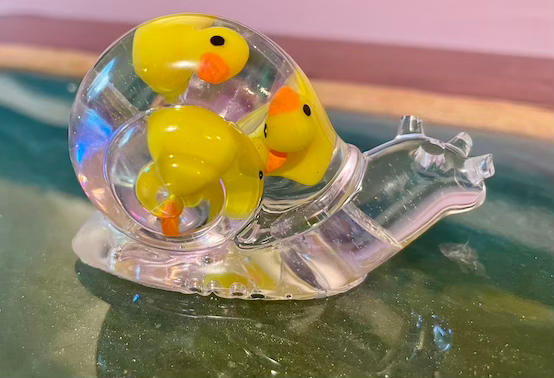 Thumbnail: Clear solid resin snail with duckies