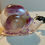 Thumbnail: Snail decoration with purple coloring and white rock