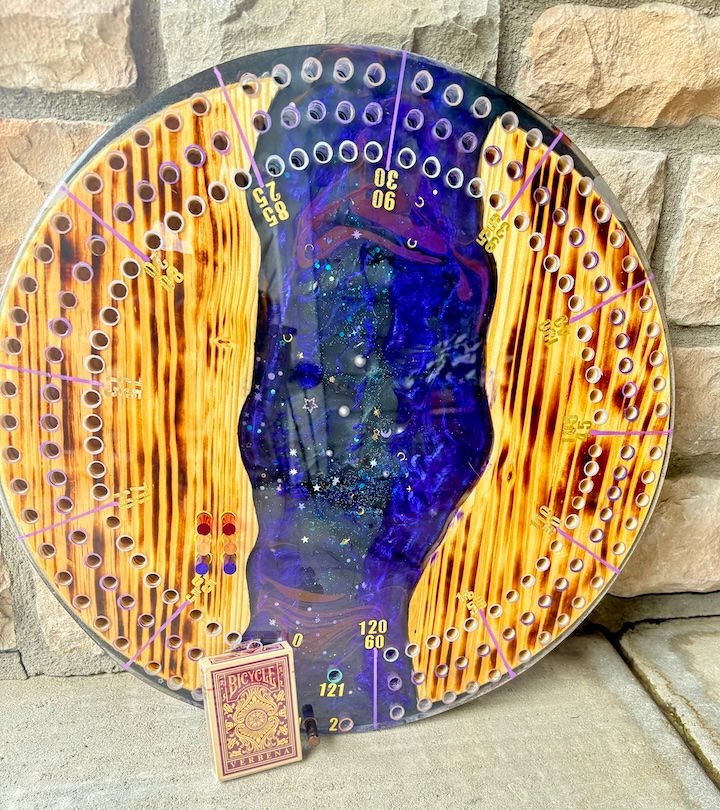 Purple round cribbage board