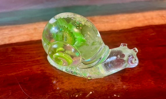 Thumbnail: Decorative snail with real green flowers